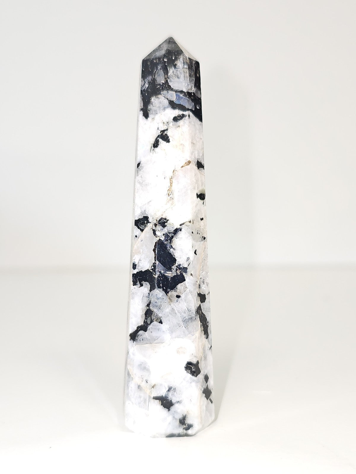 Vintage decorative obelisk in old natural stone, collectible figurine
