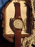 Montre homme quartz Editions Atlas vintage, cadran doré, bracelet marron rétro