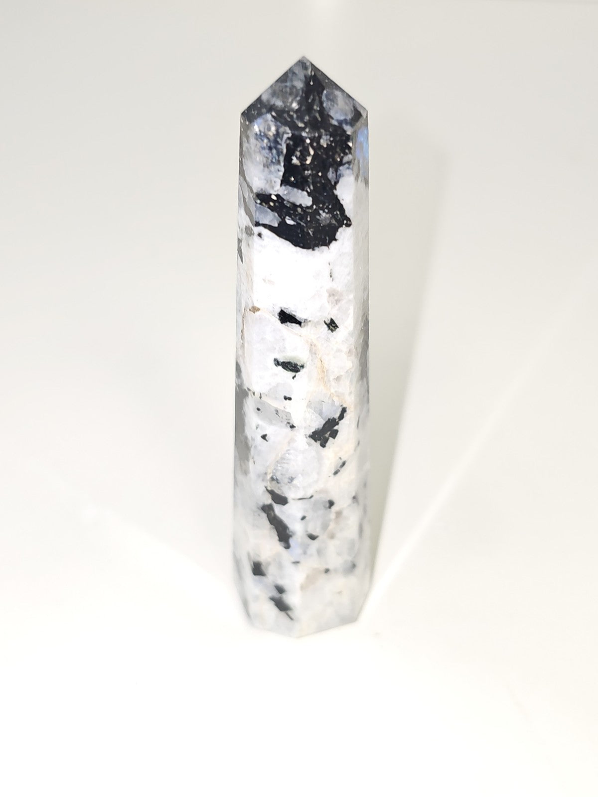 Vintage decorative obelisk in old natural stone, collectible figurine