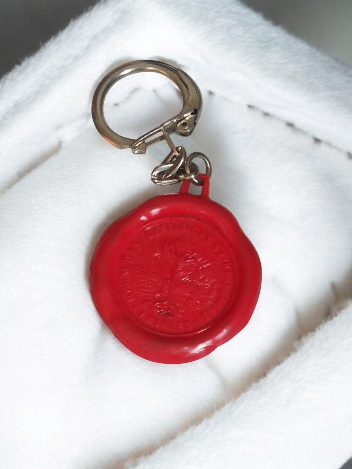 Porte-clés ancien vintage sceau rouge publicitaire rétro, objet d’occasion