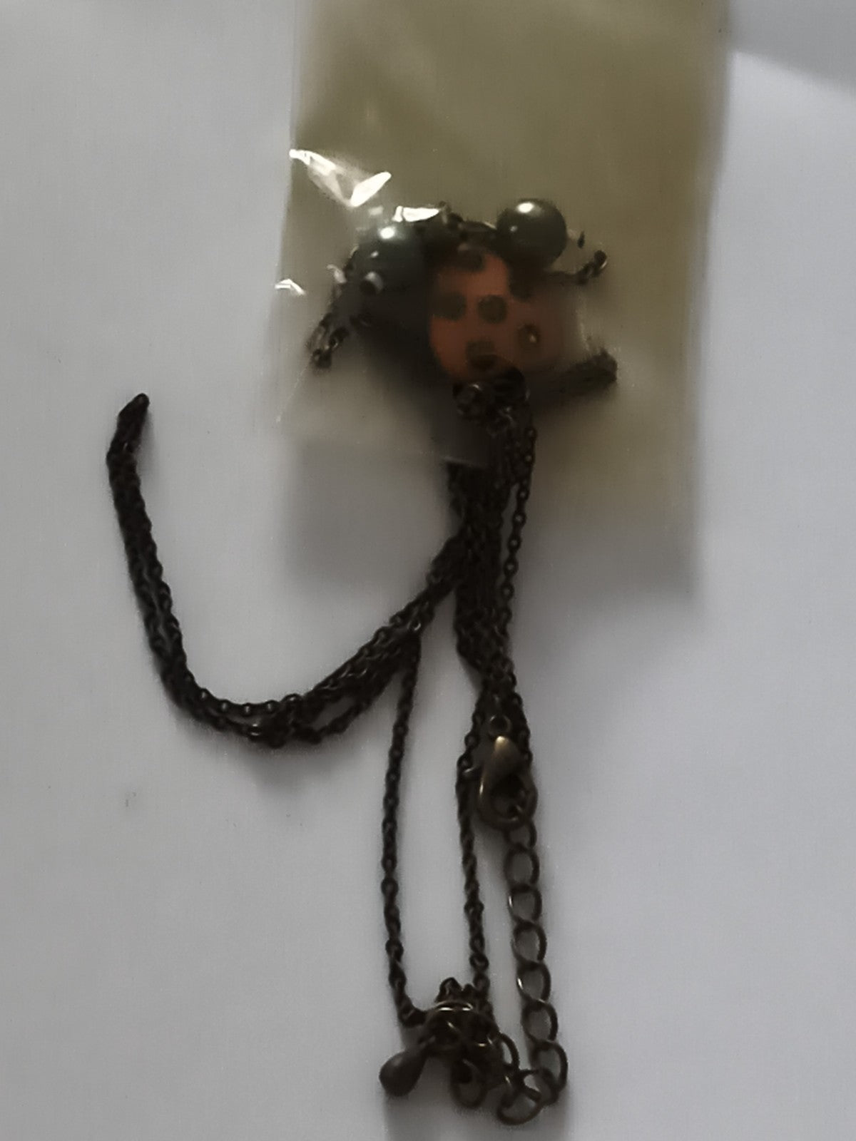 Collier vintage pendentif coccinelle chaîne bronze deadstock ancien magasin
