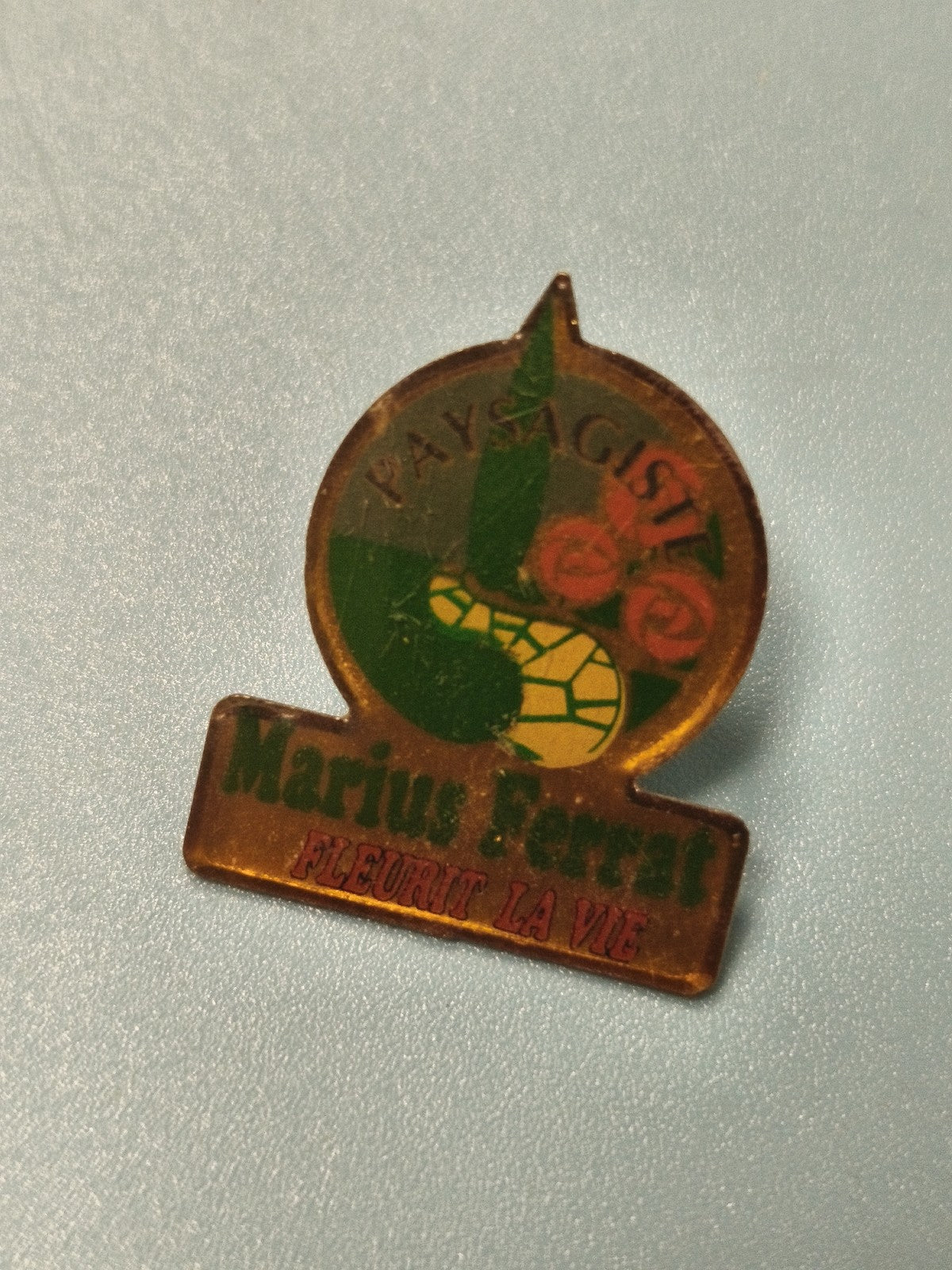Vintage pin's Marius Ferrat paysagiste logo ancien publicitaire déco rétro