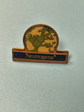 Vintage pin's Neutrogena globe ancien badge publicitaire collection