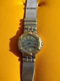 Montre femme vintage Action quartz, cadran chiffres romains, bracelet métal