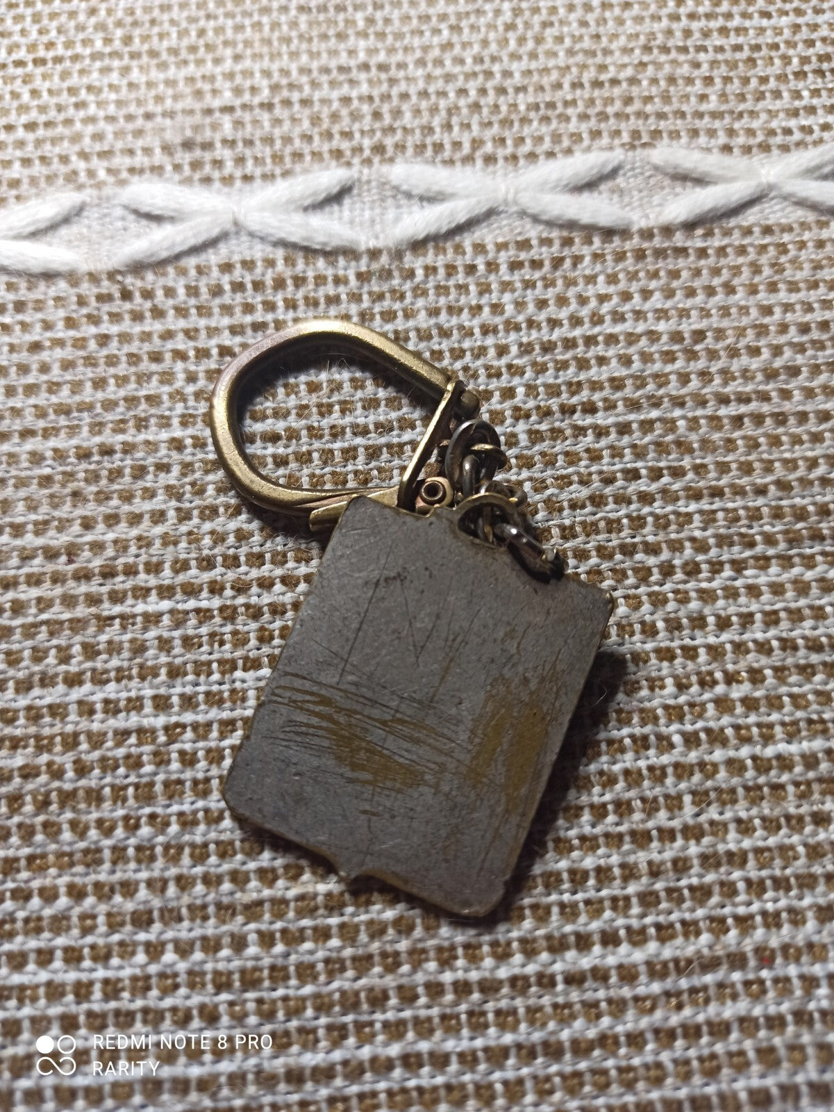 Porte-clés XXI Cross l’Humanité Épreuve Qualificative décor bronze