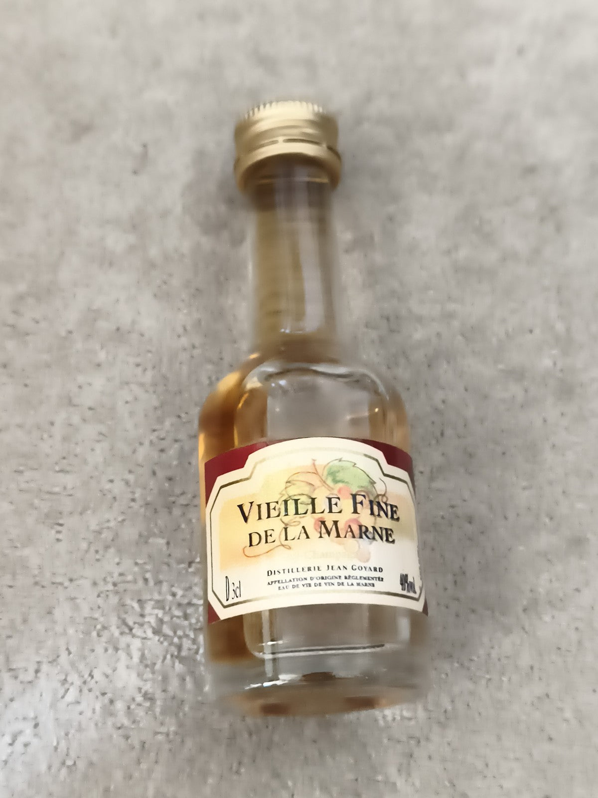 Miniature alcool Vieille Fine de la Marne Jean Goyard bouteille partiellement re