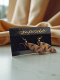 Boucles d’oreilles vintage Incomparable motif zigzag pendantes années 80