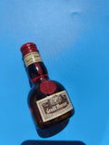 Mignonnette vintage Grand Marnier mi-pleine liqueur ancienne bouteille collectio