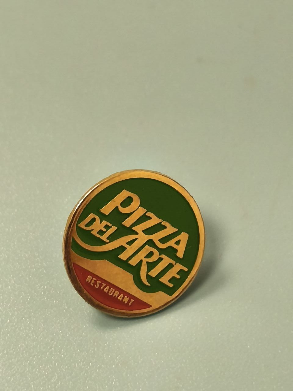 Vintage pin's Pizza Del Arte rond vert jaune ancien badge restaurant collection