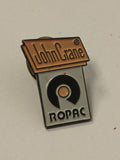 Pin's rétro ancien John Crane vintage badge collection objet publicitaire rare