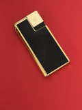 Briquet ancien design noir et doré, style vintage, allume-cigare élégant