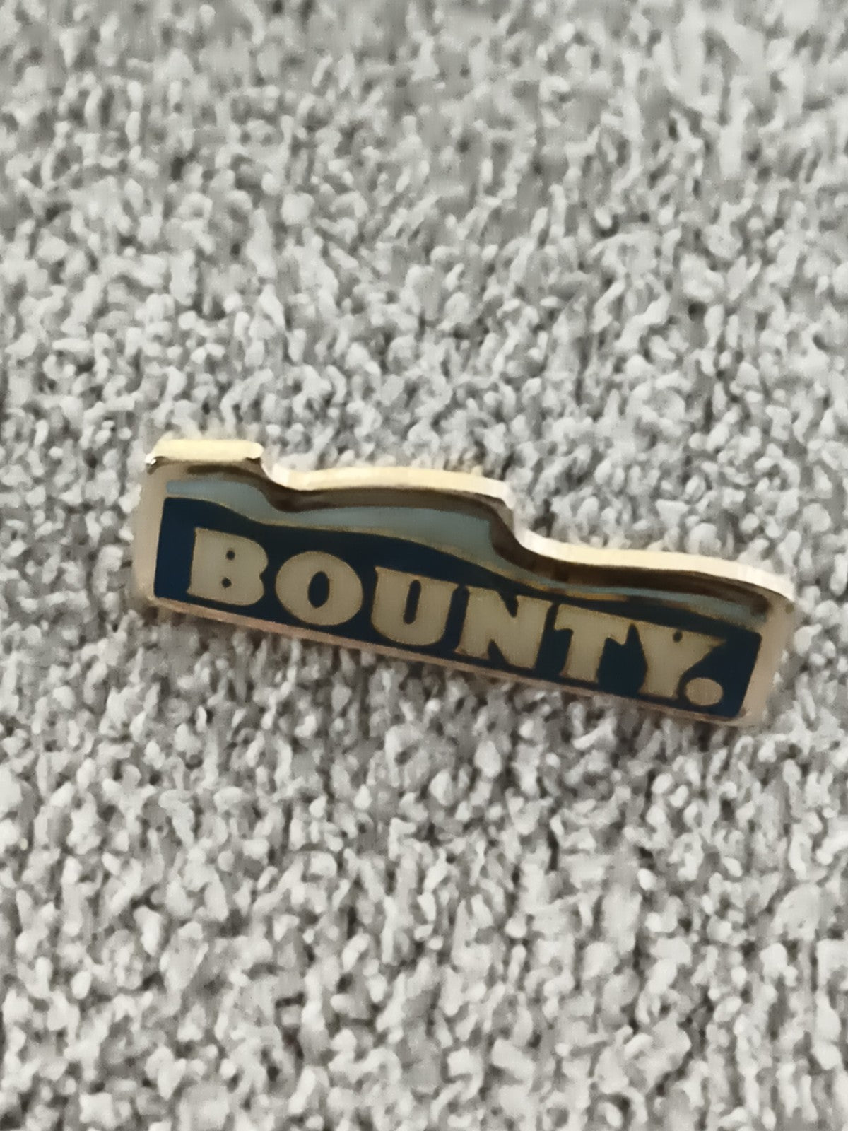 Pin's vintage Bounty bleu doré, badge publicitaire ancien (Ref 9)