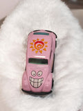 Voiture miniature vintage rose motif soleil, modèle réduit rétro ancien