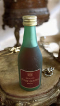 Mignonnette brandy Pedro Rovira vintage, bouteille verte, étiquette rouge