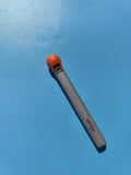Ancien briquet publicitaire CHAMP, métal gris et tête orange, à restaurer