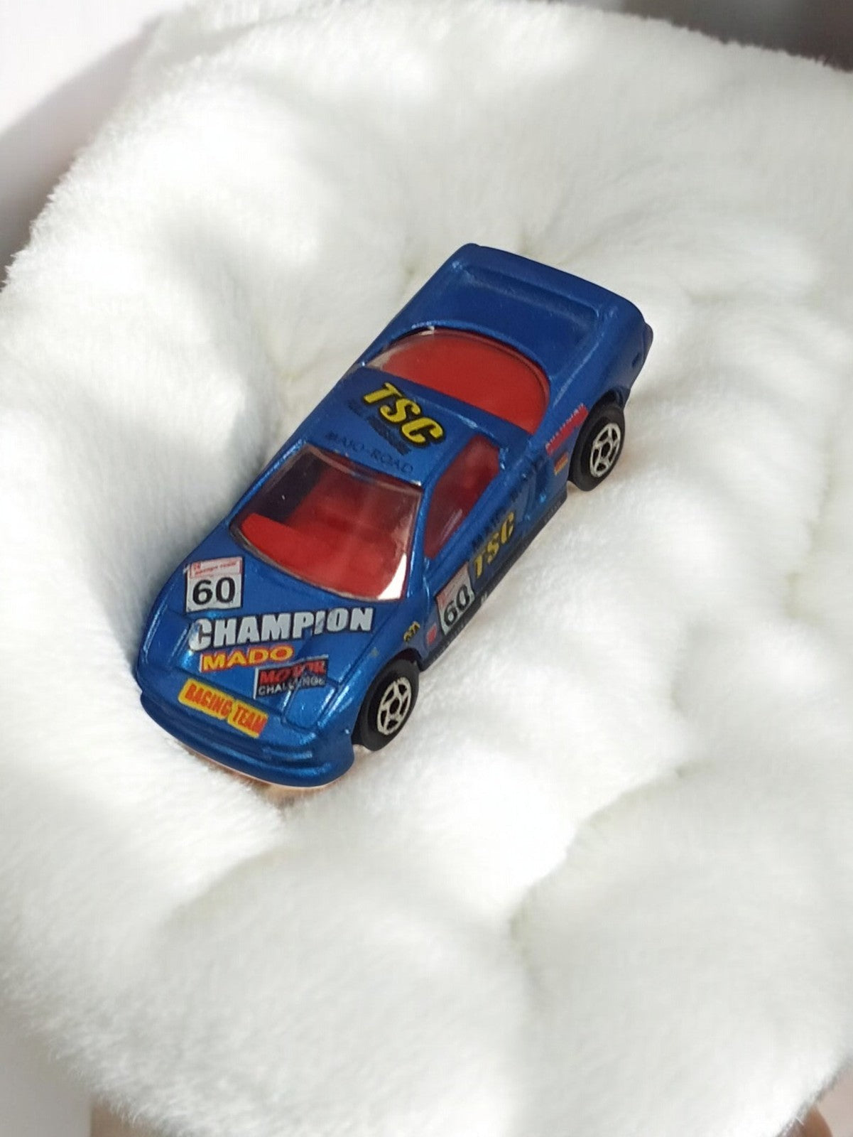 Voiture miniature vintage bleue CHAMPION TSC MADO Racing Team rétro ancien