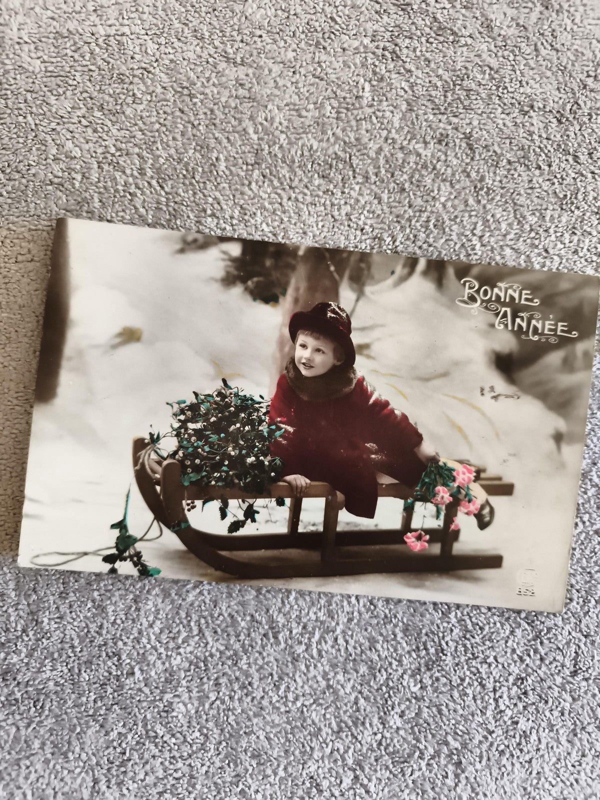 CPA Bonne Année enfant traîneau neige colorisée début XXe carte postale