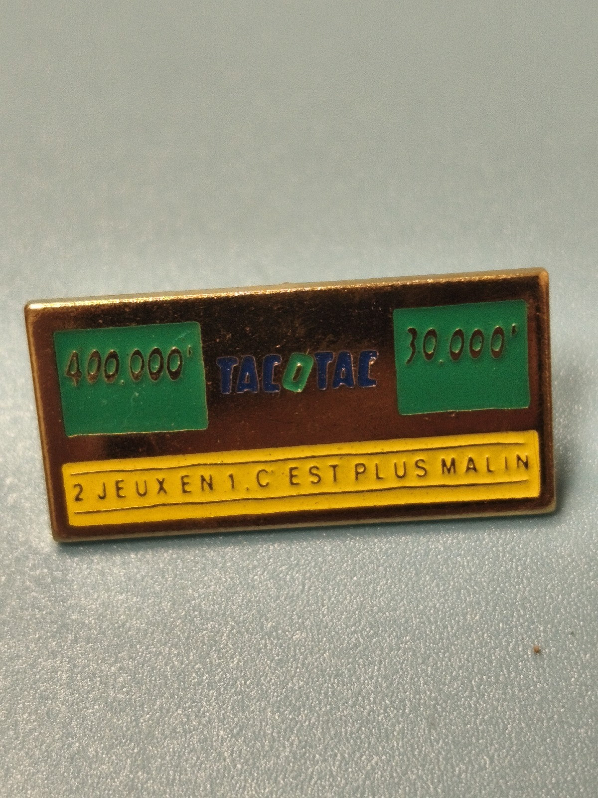 Vintage pin's publicitaire TACOTAC jeu de loterie, émaillé rectangulaire