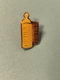 Pin's vintage TOTAL biberon jaune, collection publicité, années 80-90