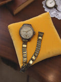 Montre mécanique vintage Majic femme DRGM, cadran patiné, bracelet métal