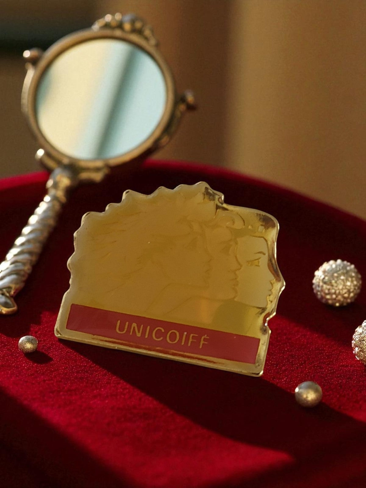 Pin's publicitaire UNICOIFF vintage doré édition limitée rare