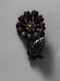 Broche vintage fleur stylisée finition sombre strass ancien rétro