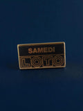 Pin's publicitaire Loto Samedi rétro noir doré années 90 vintage jeu hasard