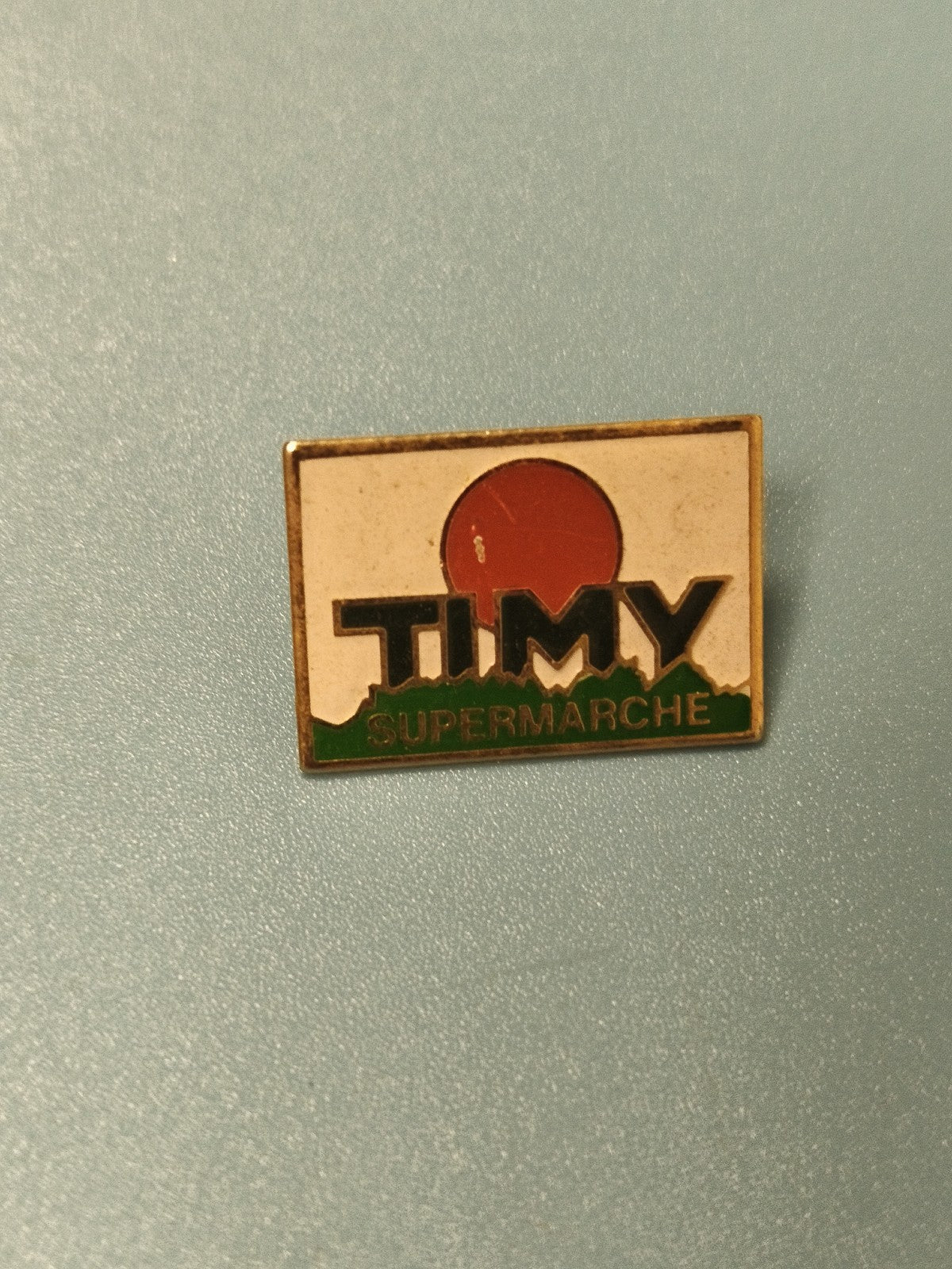 Pin's vintage TIMY Supermarché ancien, logo rectangulaire, collection pub