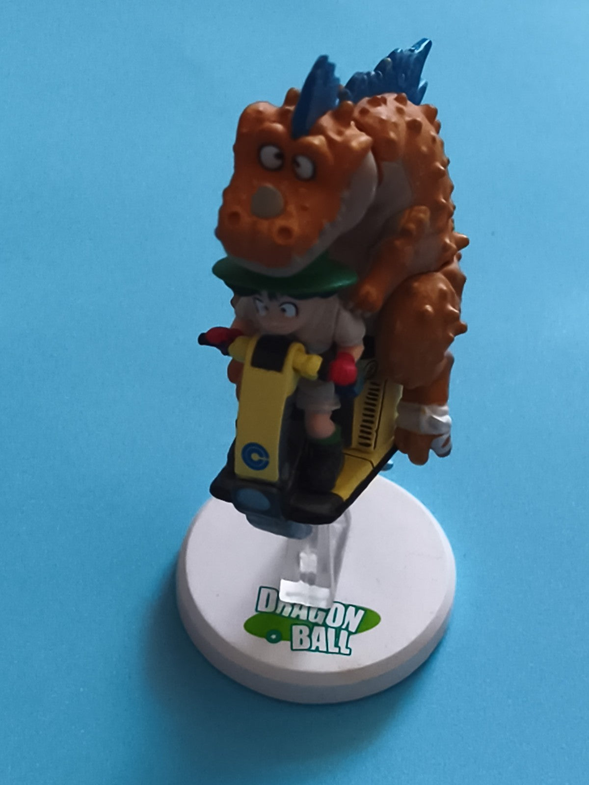 Figurine Dragon Ball Bulma moto Capsule Corp dinosaure orange DBZ déco