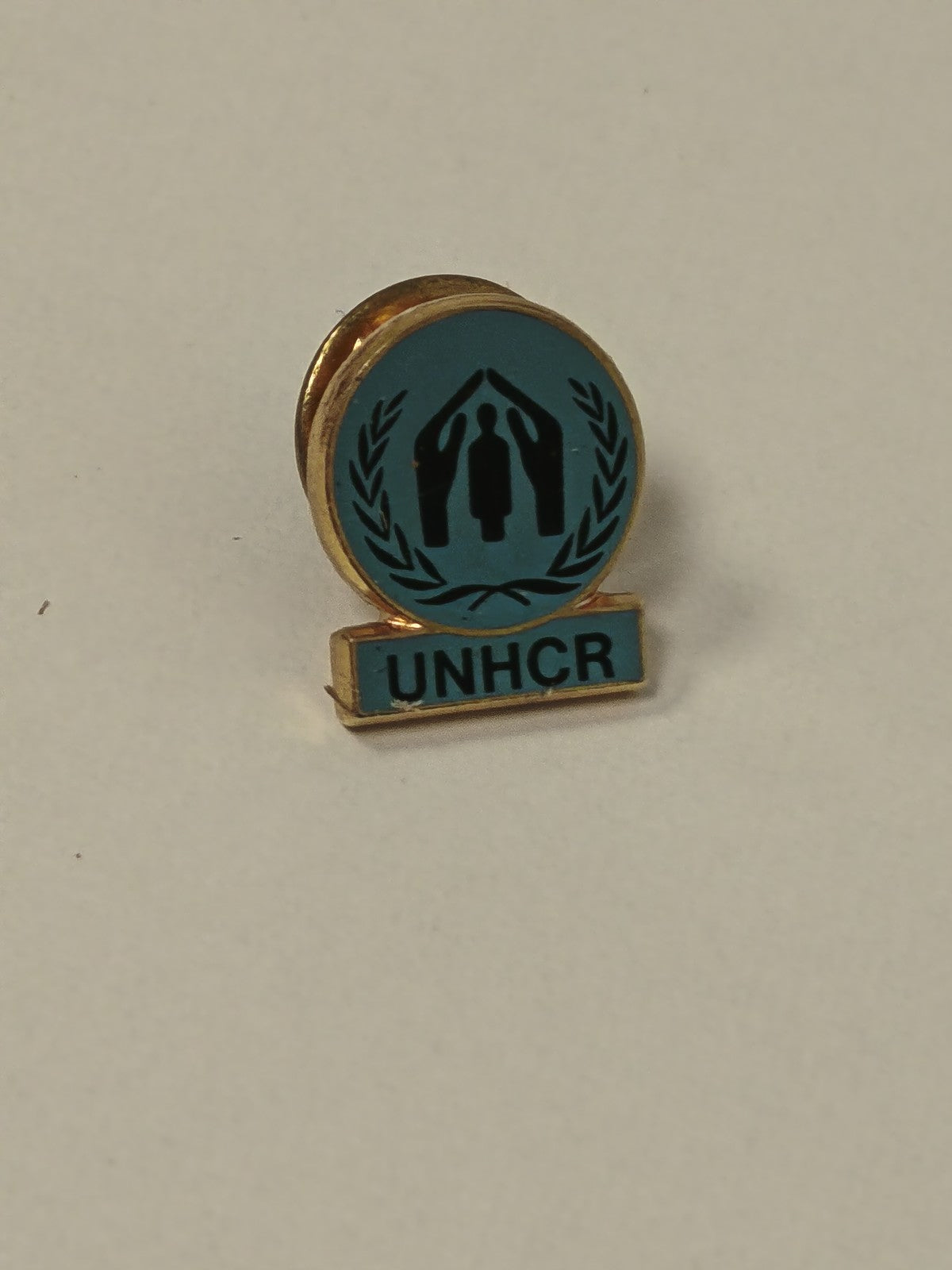 Vintage UNHCR pin, old retro humanitarian collection badge, original item