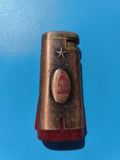 Ancien briquet publicitaire étoile rouge cuivre et plastique, à collectionner