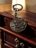 Porte-clés vintage Anjou Vinicole publicitaire, rond relief feuilles vigne