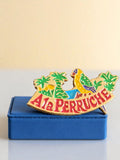 Pin's publicitaire vintage A la Perruche émaillé années 80 rétro épinglette