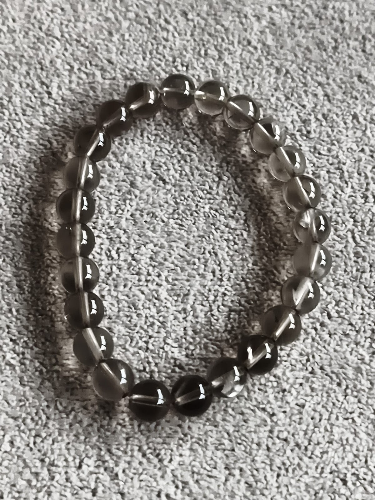 Bracelet perles rondes pierres naturelles translucides élastique gris fumé