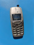 Ancien briquet publicitaire vintage forme téléphone portable 3310 en métal