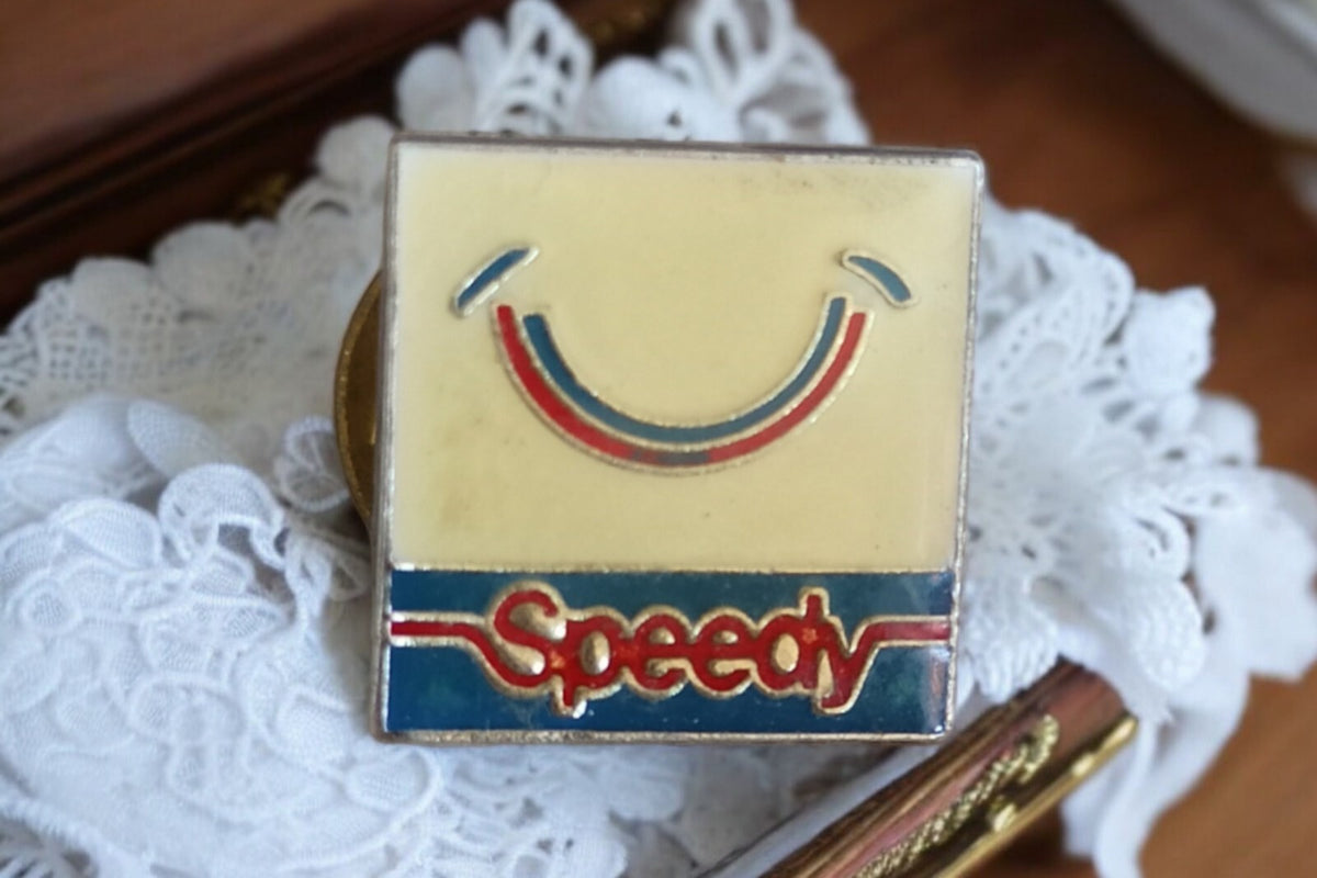Rare vintage square Speedy three-color smiley logo pin?