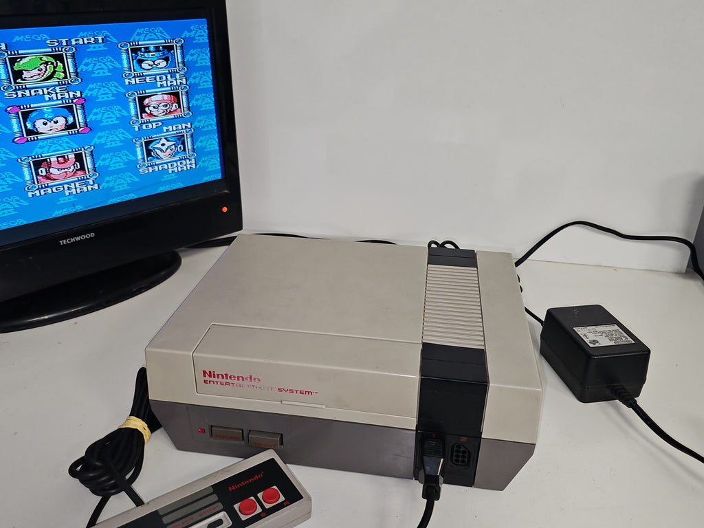 Console Nintendo NES dézonnée avec jeu Megaman 3 ? Fonctionne ? TV non incluse