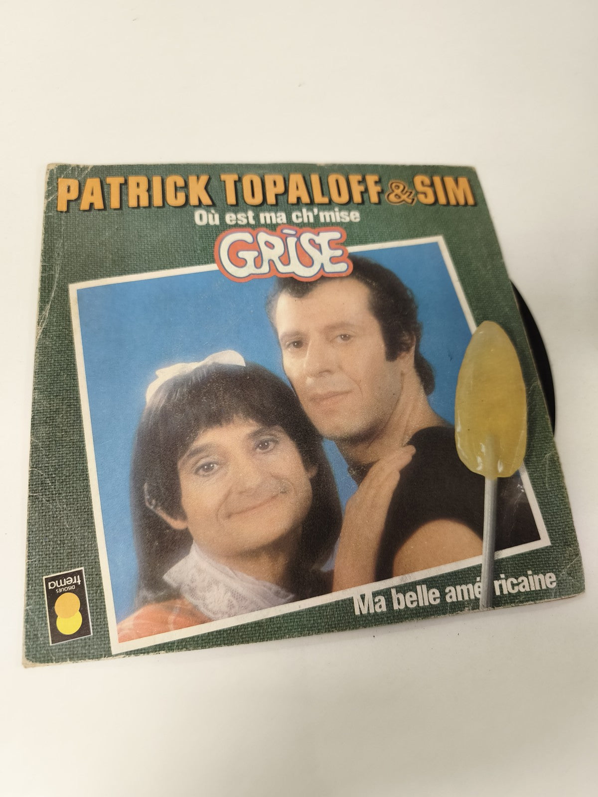 Disque vinyle 45 tours ancien gris rétro ? Collection musique vintage occasion