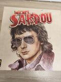 Vinyle 33T Michel Sardou pochette illustrée lunettes reflets état d'occasion