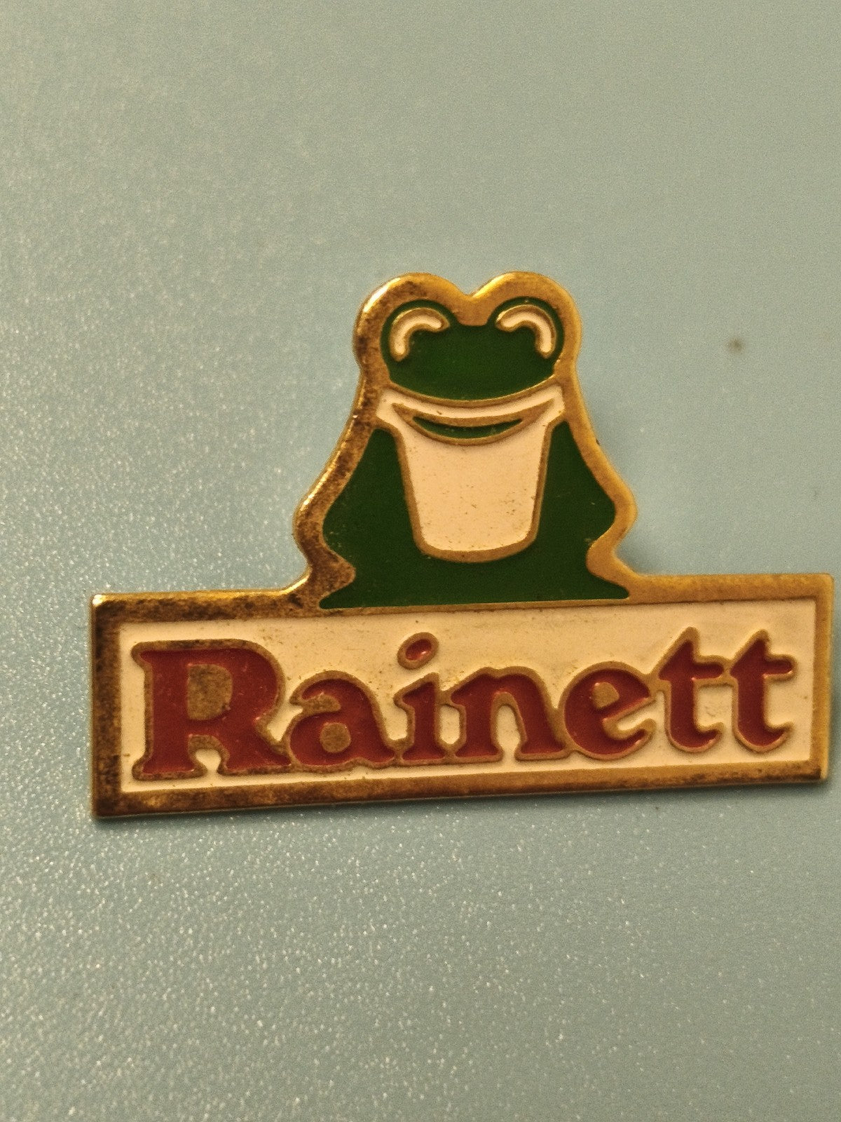 Vintage pin's Rainett grenouille verte émaillée collection publicité (Ref 6)
