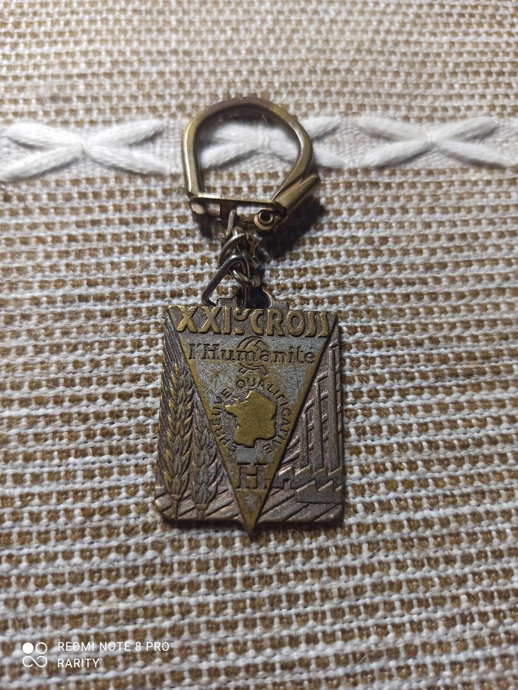 Porte-clés XXI Cross l’Humanité Épreuve Qualificative décor bronze