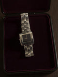 Montre femme Yves Rocher vintage cadran noir bracelet métal rétro