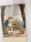 Carte postale ancienne illustrée enfant brouette fleurs chien vintage CPA