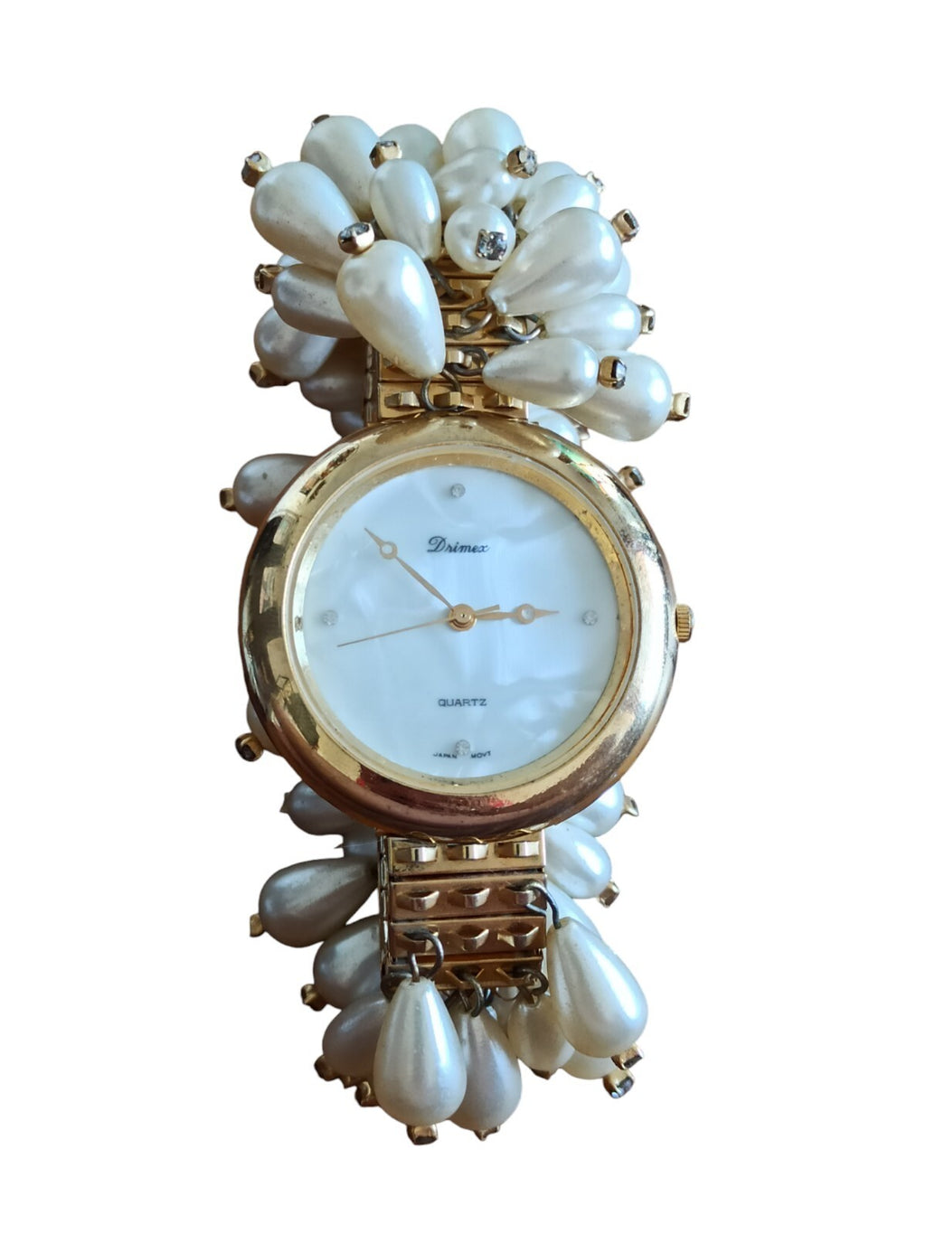 Montre femme Drimex bracelet perles nacrées doré cadran blanc élégant