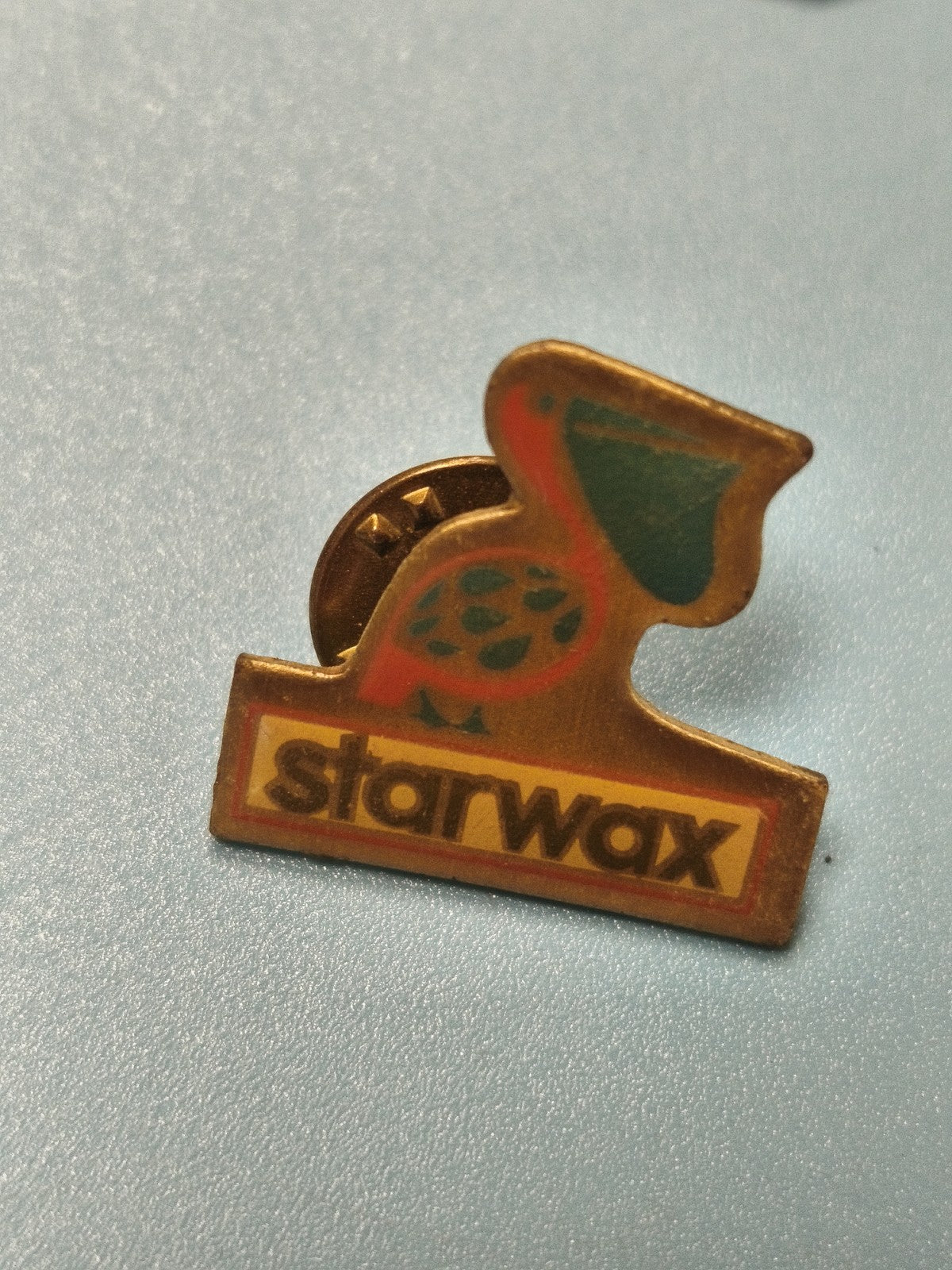 Vintage pin's publicitaire Starwax oiseau, badge ancien collection (Ref 4)