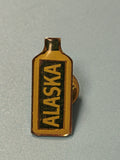 Vintage pin's Alaska bouteille jaune émaillée collection rétro (Ref 4)