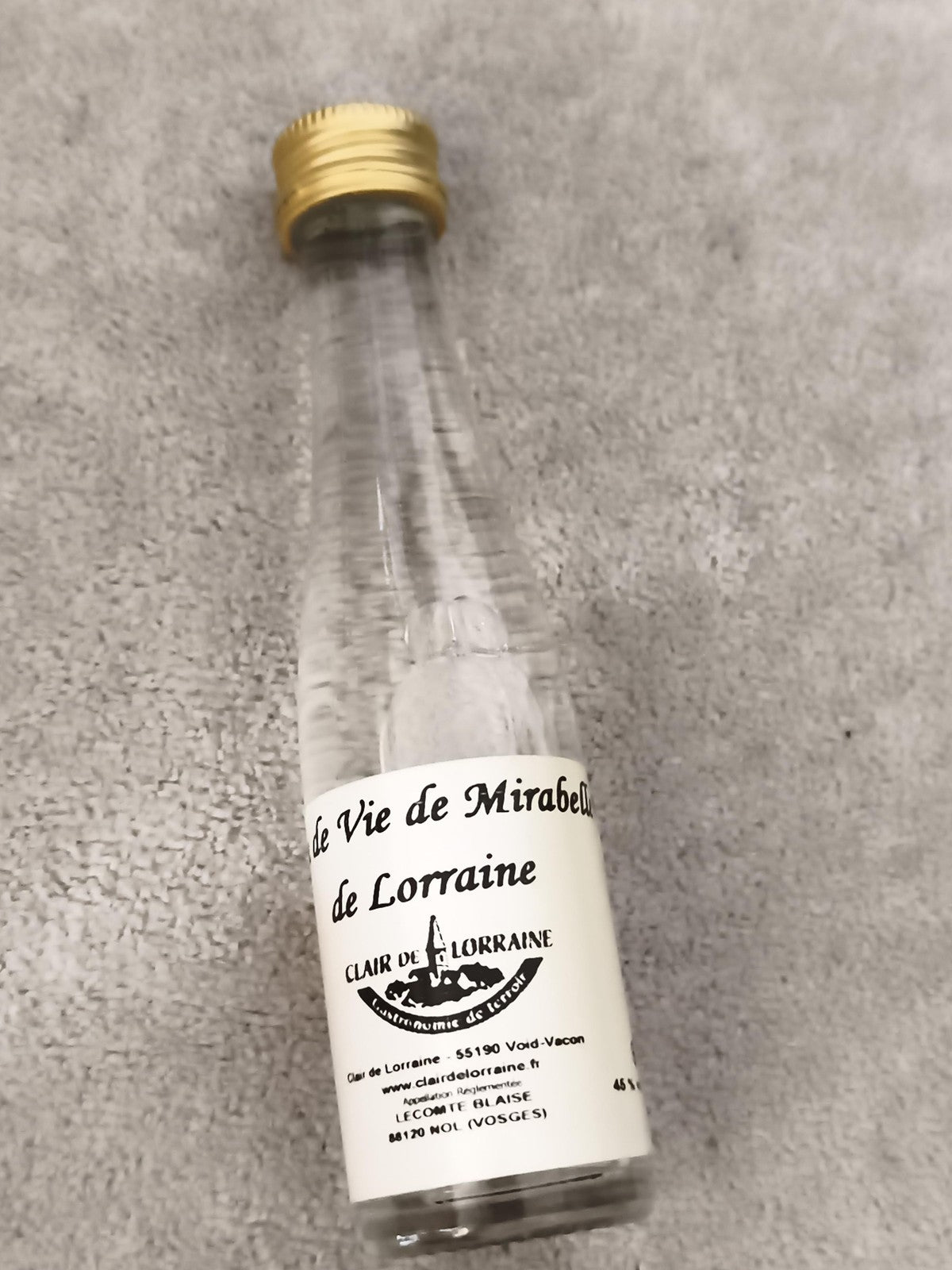 Miniature alcool Mirabelle Lorraine Clair de Lorraine bouteille partiellement re