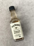 Miniature Jack Daniel's Tennessee Honey bouteille alcool partiellement remplie