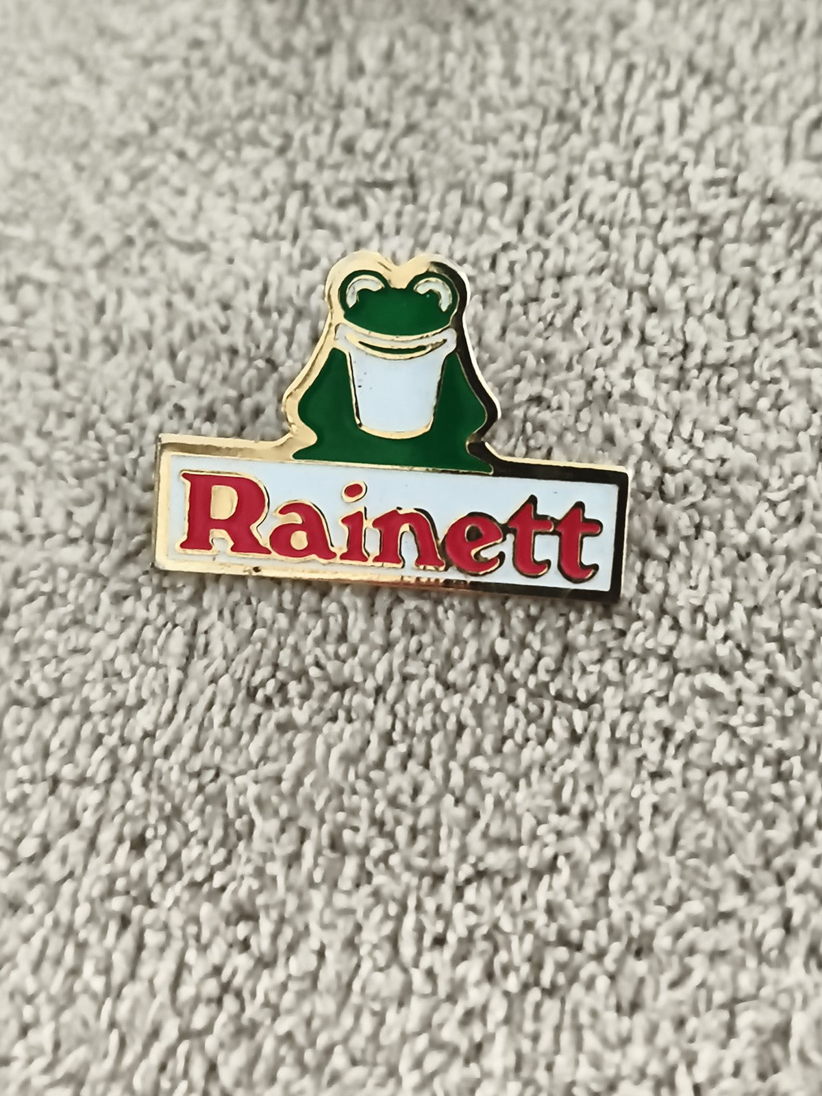 Pin's publicitaire vintage Rainett grenouille émaillée logo ancien badge (Ref 2)