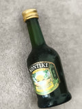 Mini-bouteille KONTIKI liqueur spécialités agrumes, étiquette illustrée, partiel
